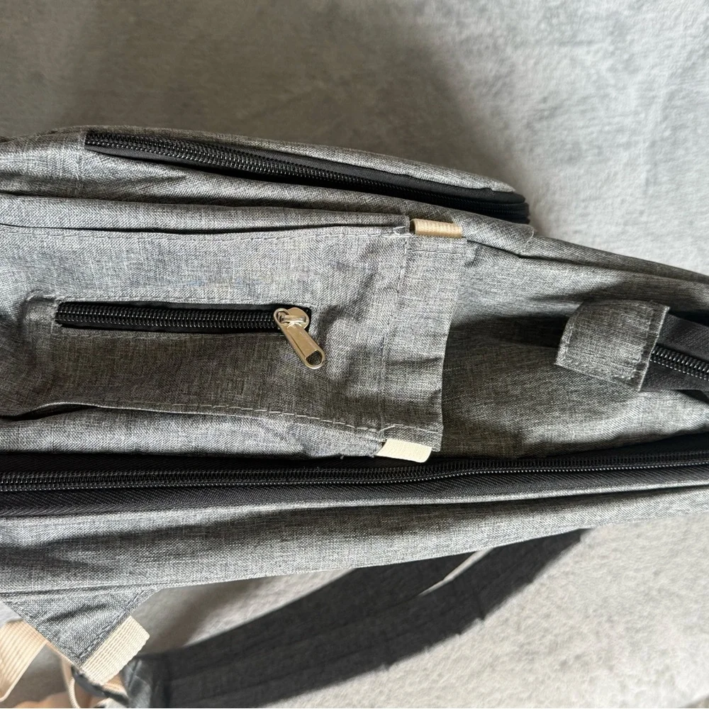 Gray Baby Backpack/Diaper Bag with fold out portable bassinet